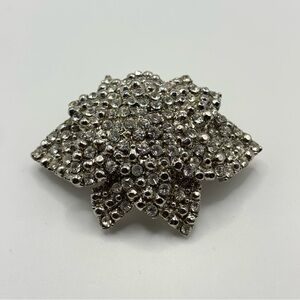 Vintage unsigned Silver tone domed floral Brooch with clear Rhinestones